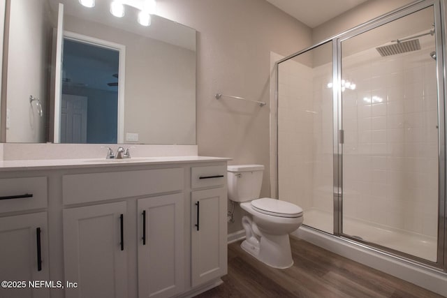 75309 White Rabbit Ave, Yulee, FL 32097 - full bath featuring wood finished floors, a shower stall, and vanity