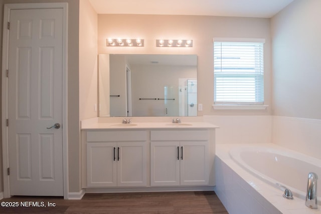 75309 White Rabbit Ave, Yulee, FL 32097 - bathroom with a bath, double vanity, a shower with shower door, and wood finished floors