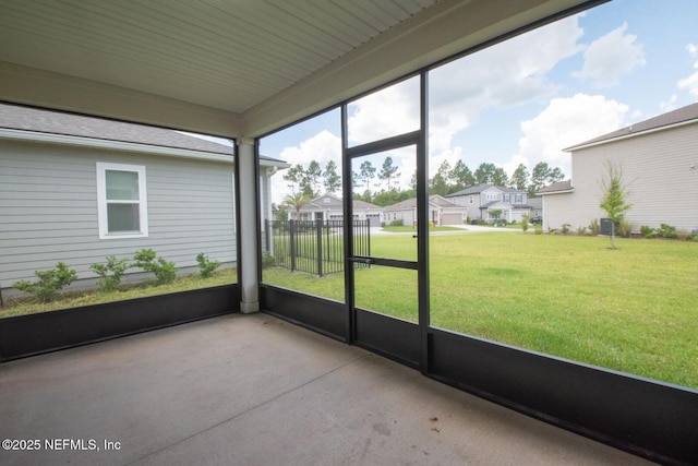 75309 White Rabbit Ave, Yulee, FL 32097 - unfurnished sunroom featuring a residential view