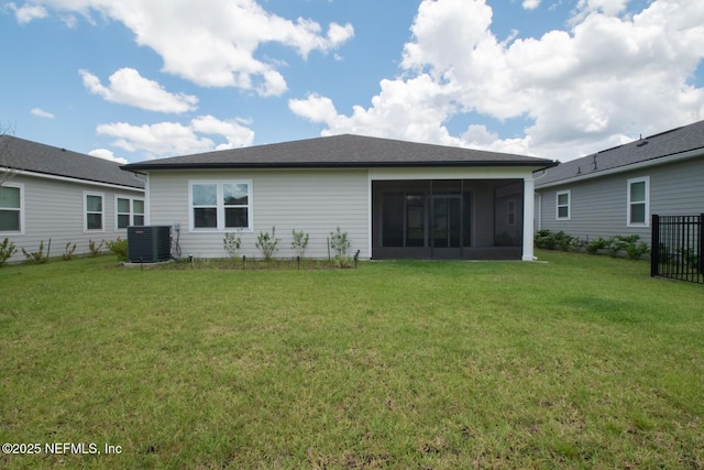 75309 White Rabbit Ave, Yulee, FL 32097 - rear view of house featuring a sunroom and a yard