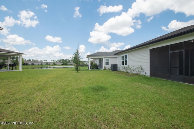 75309 White Rabbit Ave, Yulee, FL 32097 - view of green lawn with a water view and a sunroom
