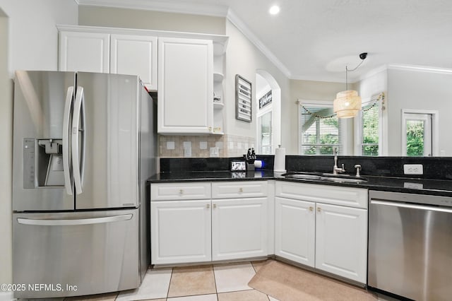 13738 Harbor Creek Pl, Jacksonville, FL 32224 - kitchen featuring tasteful backsplash, light tile patterned floors, white cabinets, appliances with stainless steel finishes, and a sink