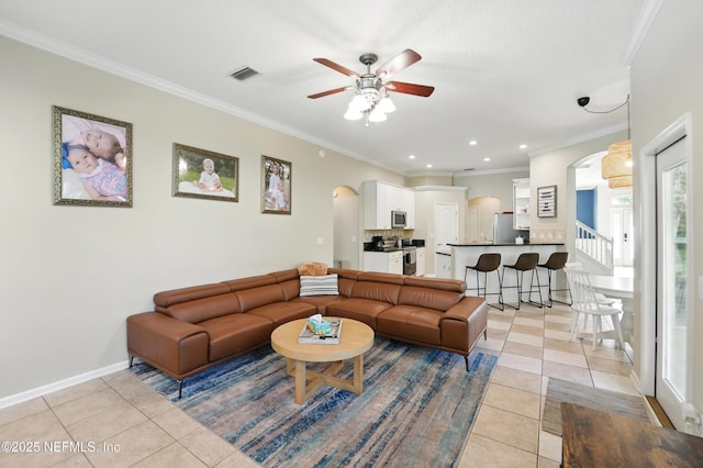 13738 Harbor Creek Pl, Jacksonville, FL 32224 - living area with crown molding, light tile patterned floors, arched walkways, a ceiling fan, and visible vents