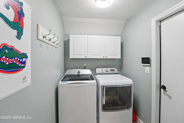 13738 Harbor Creek Pl, Jacksonville, FL 32224 - washroom with cabinet space, washing machine and clothes dryer, and a textured ceiling