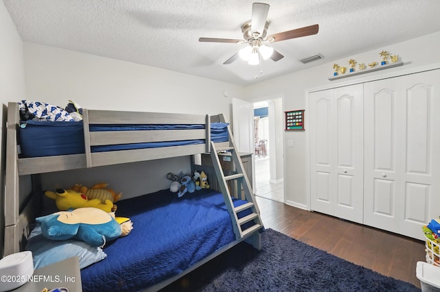 13738 Harbor Creek Pl, Jacksonville, FL 32224 - bedroom with visible vents, a closet, wood finished floors, and a textured ceiling