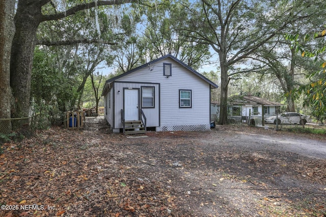 1354 Crestwood St, Jacksonville, FL 32208 - back of property featuring entry steps and fence