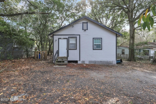 1354 Crestwood St, Jacksonville, FL 32208 - back of house with entry steps and fence