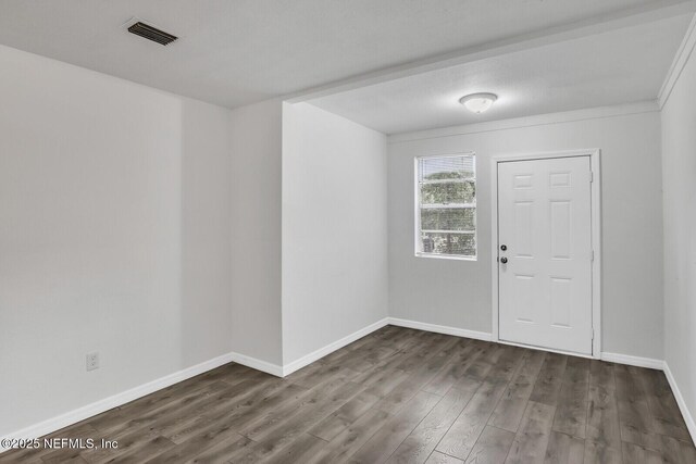 1354 Crestwood St, Jacksonville, FL 32208 - foyer with visible vents, baseboards, and dark wood finished floors