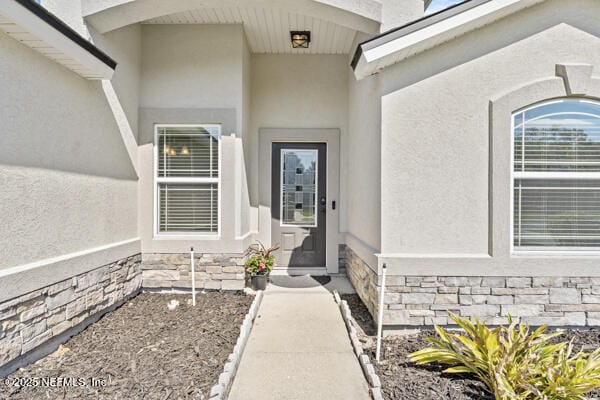116 Timberwood Dr, Saint Augustine, FL 32084 - entrance to property with stone siding and stucco siding