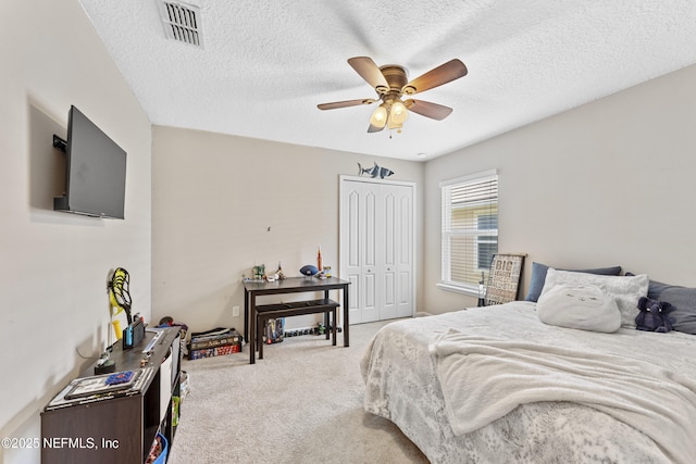 116 Timberwood Dr, Saint Augustine, FL 32084 - bedroom featuring carpet, a closet, a textured ceiling, and ceiling fan