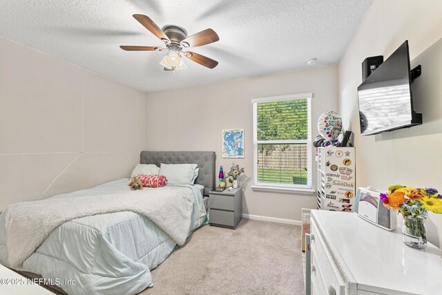 116 Timberwood Dr, Saint Augustine, FL 32084 - bedroom featuring light colored carpet, a textured ceiling, a ceiling fan, and baseboards