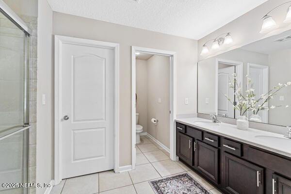 116 Timberwood Dr, Saint Augustine, FL 32084 - full bath with toilet, double vanity, a shower stall, and tile patterned flooring