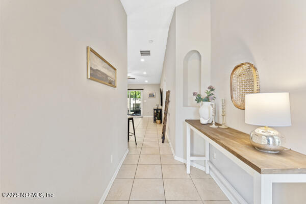 116 Timberwood Dr, Saint Augustine, FL 32084 - hallway with light tile patterned floors and baseboards