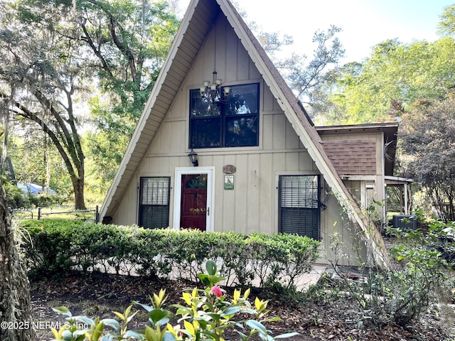 510 W Hillsborough Ave, Florahome, FL 32140 - exterior space with central AC unit and board and batten siding