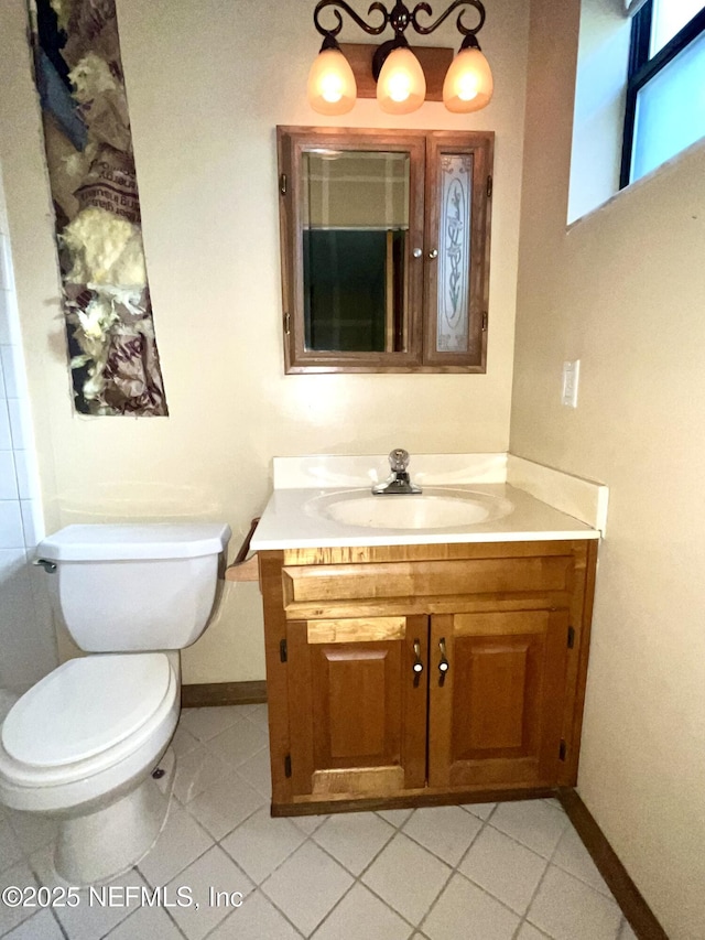 510 W Hillsborough Ave, Florahome, FL 32140 - bathroom with vanity, baseboards, and toilet