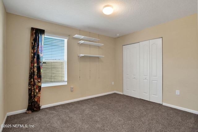 2351 Oak Stream Dr, Green Cove Springs, FL 32043 - unfurnished bedroom with a closet, baseboards, carpet, and a textured ceiling