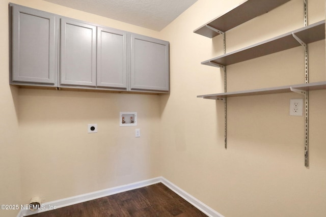 2351 Oak Stream Dr, Green Cove Springs, FL 32043 - laundry room featuring dark wood-type flooring, hookup for an electric dryer, washer hookup, baseboards, and cabinet space