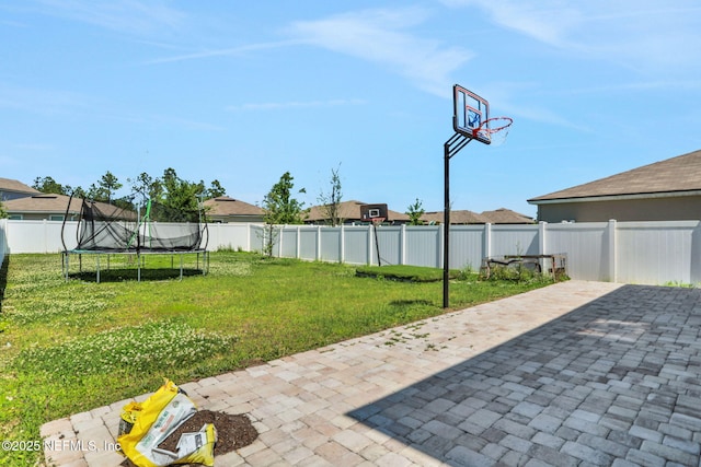 2351 Oak Stream Dr, Green Cove Springs, FL 32043 - exterior space featuring a fenced backyard, a trampoline, and a patio