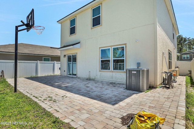 2351 Oak Stream Dr, Green Cove Springs, FL 32043 - back of property with a patio area, fence, central AC unit, and stucco siding