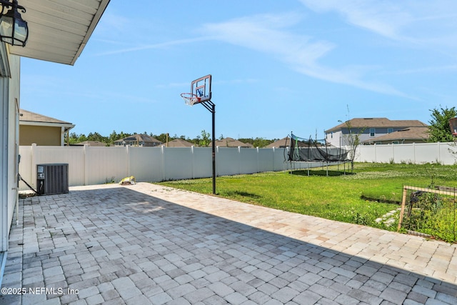 2351 Oak Stream Dr, Green Cove Springs, FL 32043 - view of patio featuring a trampoline, a fenced backyard, and cooling unit
