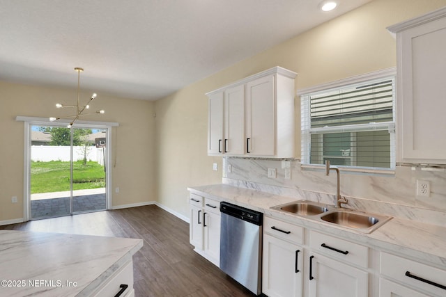 2351 Oak Stream Dr, Green Cove Springs, FL 32043 - kitchen featuring stainless steel dishwasher, an inviting chandelier, dark wood finished floors, a sink, and decorative backsplash