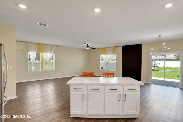 2351 Oak Stream Dr, Green Cove Springs, FL 32043 - kitchen featuring open floor plan, ceiling fan with notable chandelier, and visible vents