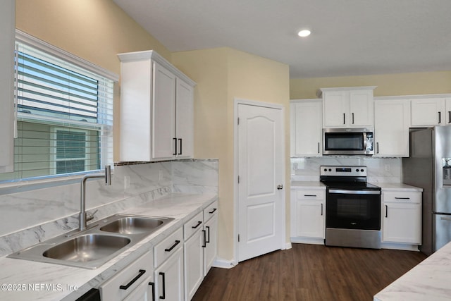 2351 Oak Stream Dr, Green Cove Springs, FL 32043 - kitchen with white cabinets, a sink, light countertops, dark wood finished floors, and stainless steel appliances