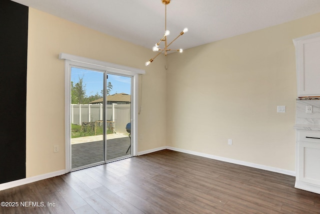 2351 Oak Stream Dr, Green Cove Springs, FL 32043 - interior space featuring baseboards, an inviting chandelier, and wood finished floors