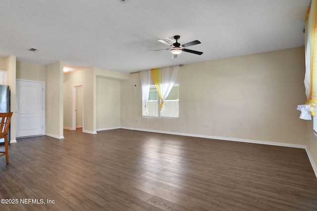2351 Oak Stream Dr, Green Cove Springs, FL 32043 - unfurnished living room featuring dark wood-type flooring, ceiling fan, and baseboards