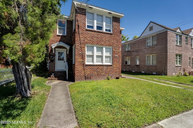 2649 Dellwood Ave, Jacksonville, FL 32204 - view of front of property featuring entry steps, a front yard, fence, and brick siding