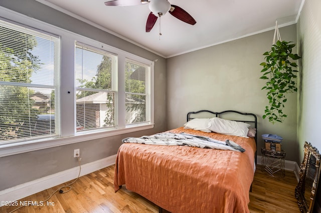 2649 Dellwood Ave, Jacksonville, FL 32204 - bedroom featuring light wood-style floors, multiple windows, ornamental molding, and baseboards