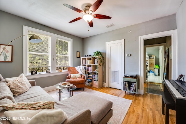 2649 Dellwood Ave, Jacksonville, FL 32204 - living room with wood finished floors, ceiling fan, and visible vents