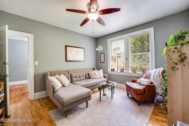 2649 Dellwood Ave, Jacksonville, FL 32204 - living room featuring light wood-type flooring, baseboards, and ceiling fan