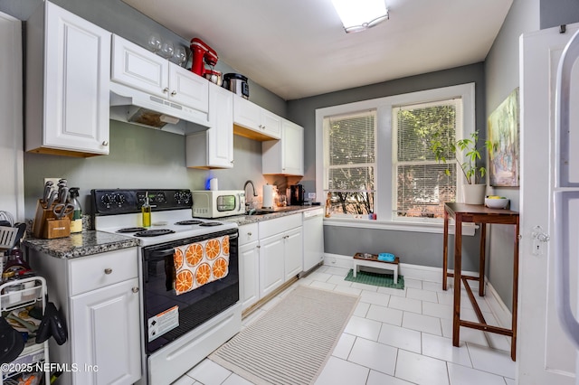 2649 Dellwood Ave, Jacksonville, FL 32204 - kitchen with baseboards, white appliances, white cabinetry, under cabinet range hood, and a sink
