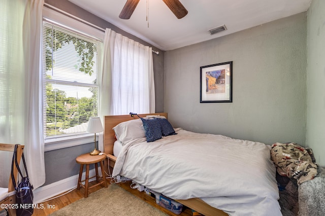 2649 Dellwood Ave, Jacksonville, FL 32204 - bedroom featuring ceiling fan, visible vents, wood finished floors, a textured wall, and baseboards
