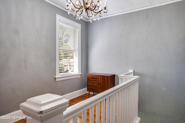 2649 Dellwood Ave, Jacksonville, FL 32204 - interior space featuring an inviting chandelier, ornamental molding, wood finished floors, a textured wall, and baseboards