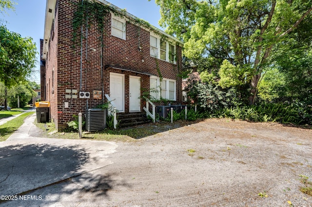 2649 Dellwood Ave, Jacksonville, FL 32204 - exterior space featuring central air condition unit and brick siding