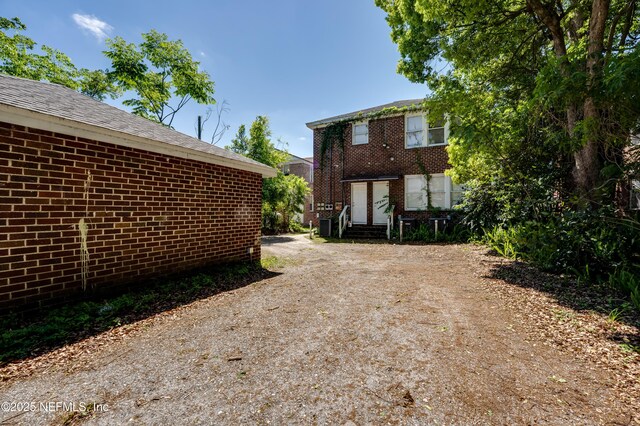 2649 Dellwood Ave, Jacksonville, FL 32204 - exterior space featuring brick siding, entry steps, and driveway