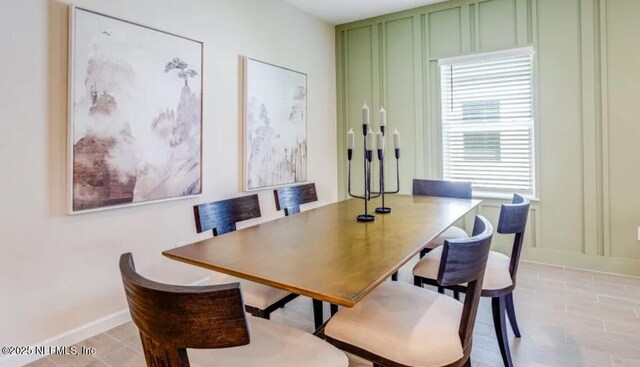 2781 Seasons Rd, Green Cove Springs, FL 32043 - dining room featuring a decorative wall and baseboards