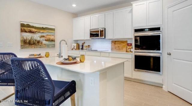 2781 Seasons Rd, Green Cove Springs, FL 32043 - kitchen featuring a sink, decorative backsplash, stainless steel appliances, light countertops, and recessed lighting