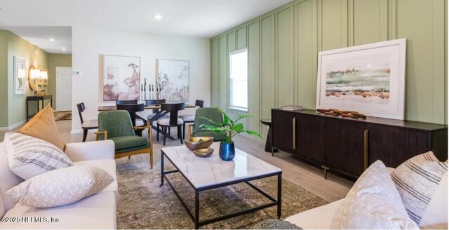 2781 Seasons Rd, Green Cove Springs, FL 32043 - living room featuring baseboards, recessed lighting, light wood-style floors, and a decorative wall