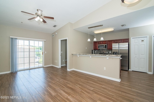 8235 Lobster Bay Ct Unit 305, Jacksonville, FL 32256 - kitchen featuring visible vents, ceiling fan, appliances with stainless steel finishes, and a peninsula