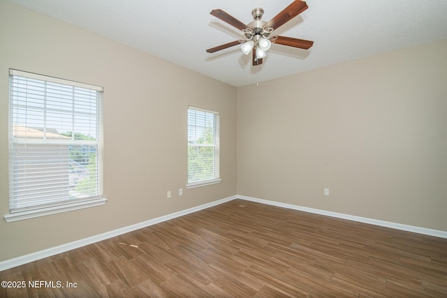 8235 Lobster Bay Ct Unit 305, Jacksonville, FL 32256 - spare room with ceiling fan, baseboards, wood finished floors, and a healthy amount of sunlight