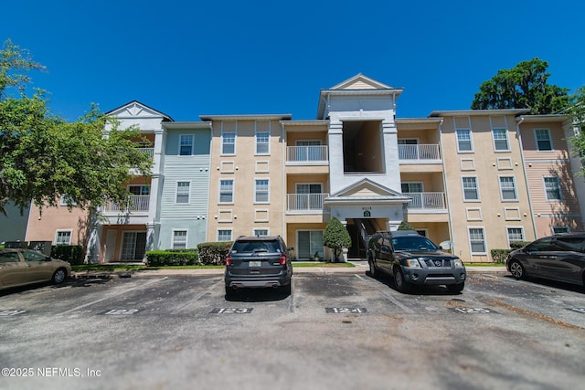 8235 Lobster Bay Ct Unit 305, Jacksonville, FL 32256 - view of property featuring uncovered parking