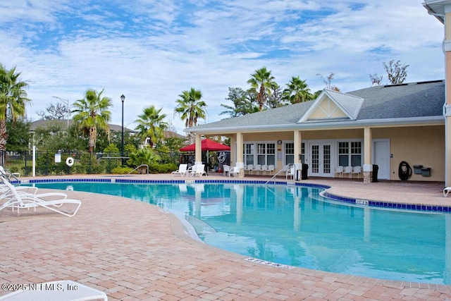8235 Lobster Bay Ct Unit 305, Jacksonville, FL 32256 - community pool featuring a patio, french doors, and fence