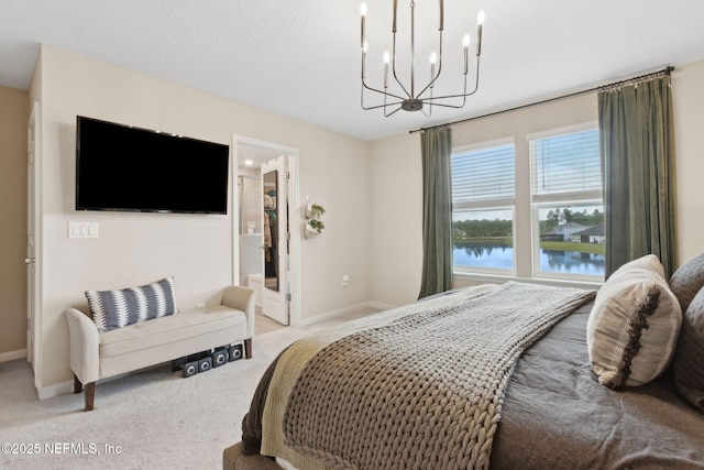 75743 Spoonbill Ln, Yulee, FL 32097 - bedroom featuring light carpet, a water view, a notable chandelier, and baseboards