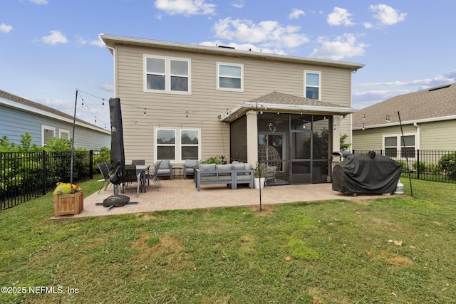 75743 Spoonbill Ln, Yulee, FL 32097 - back of house featuring an outdoor living space, a sunroom, a fenced backyard, a lawn, and a patio