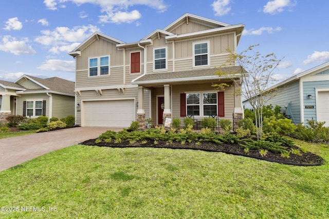 75743 Spoonbill Ln, Yulee, FL 32097 - craftsman inspired home with a garage, a front yard, driveway, and board and batten siding