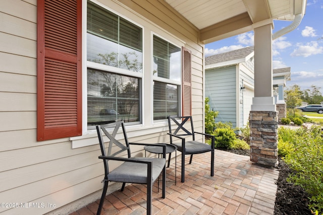 75743 Spoonbill Ln, Yulee, FL 32097 - view of patio / terrace featuring a porch