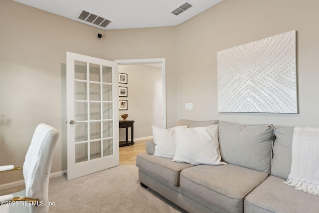 75743 Spoonbill Ln, Yulee, FL 32097 - living room featuring visible vents, baseboards, and french doors